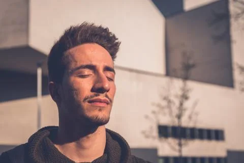 Young  man posing in an urban context Stock Photos