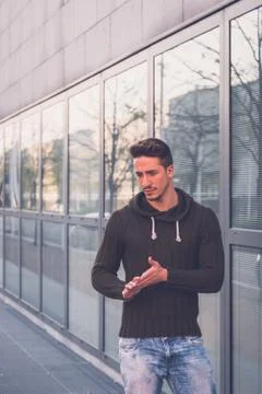 Young  man posing in an urban context Stock Photos