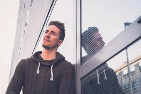 Young  man posing in an urban context Stock Photos