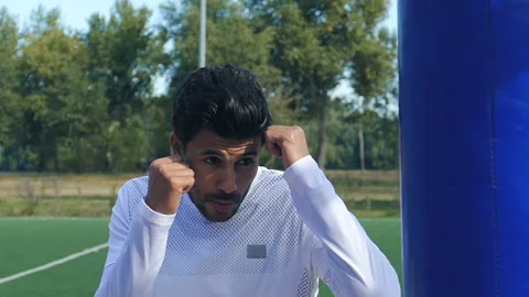 Young man practicing in boxing outdoors. Stock Footage 97384864