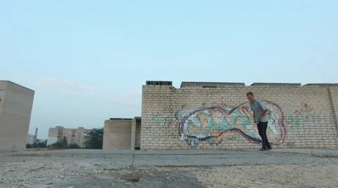 Young man practicing flips and jumps at the roof of building Stock Footage 67315262