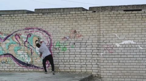 Young man practicing flips and jumps at the roof of building. Stock Footage 67316134