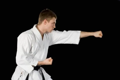 A young man practicing karate Stock Photos