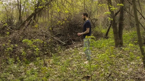 Young man practicing karate in the spring forest. Stock-Footage 80652735