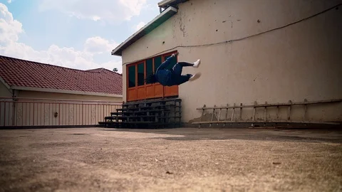  Young man practicing parkour at home Stock Footage 117700549