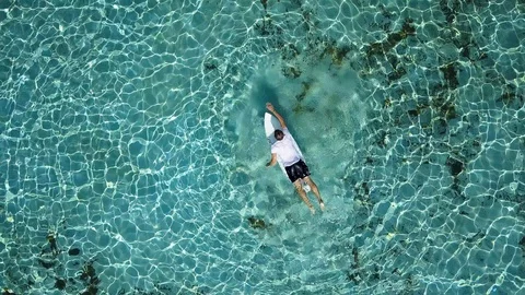 Young man is practicing surfing Shoot footage from aerial view to drone. Stock Footage 96311615