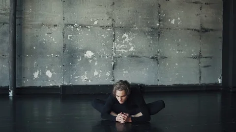 Young man practicing yoga alone Stock Footage 94123494