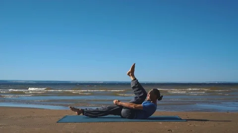 Young man practicing yoga. Basic yoga pose: chaturanga dandasana. Stock Footage 80794273