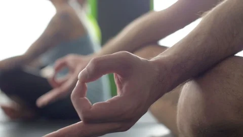 Young man practicing yoga in fitness studio Stock Footage