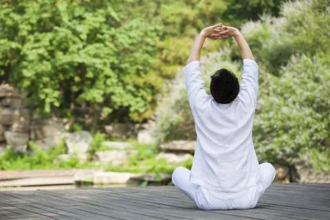 Young man practicing yoga Stock Photos