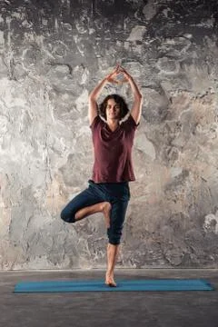 Young man practicing yoga Stock Photos