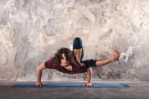 Young man practicing yoga Stock Photos
