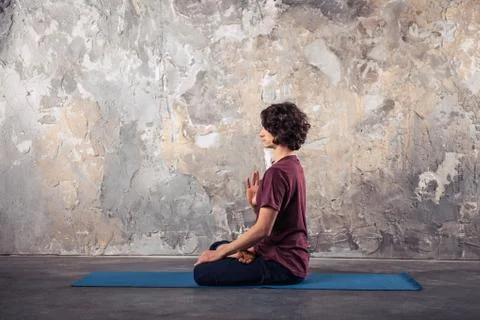 Young man practicing yoga Stock Photos
