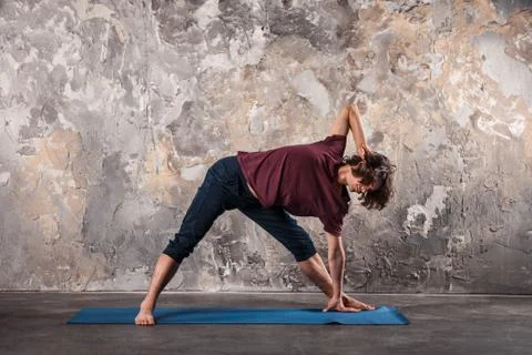 Young man practicing yoga Stock Photos