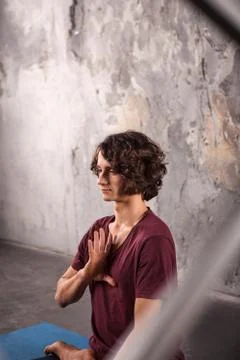 Young man practicing yoga Stock Photos