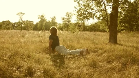 Young man practicing yoga in a summer forest. Stock-Footage 79569553