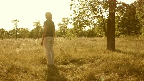 Young man practicing yoga in a summer forest. 스톡 동영상 79572727