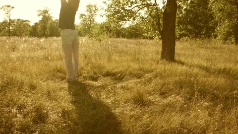 Young man practicing yoga in a summer forest. 스톡 동영상 79581494
