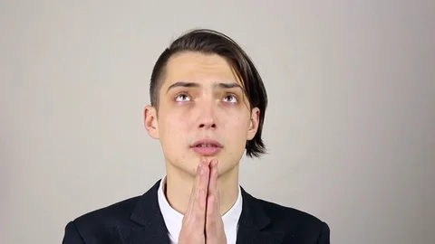 Young man praying, asking God for help. Stock Footage 73652194