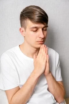 Young Man praying Stock Photos