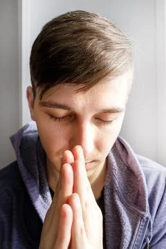 Young Man praying Stock Photos