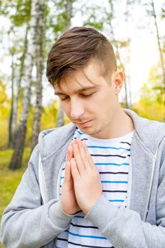 Young Man praying Stock Photos