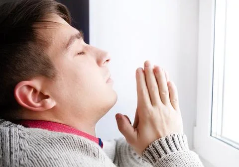 Young Man is praying Stock Photos