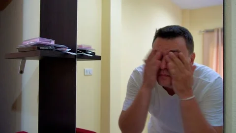 Young Man Preen Himself infront of the Mirror Video stock 72400818