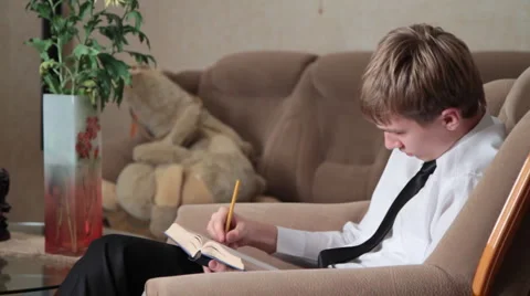 Young man prepares for study. III. Stock Footage 951777