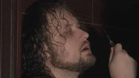 Young man preparing and using drugs. The heroin. 4K Stock Footage 44202338