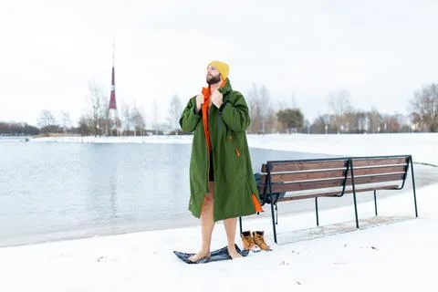 Young man is preparing for a cold winter swim, a healthy lifestyle. Stock Photos
