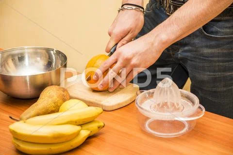 Young Man Preparing A Fruit Salad Or Smoothie