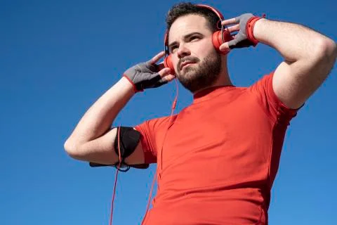 Young man preparing to run with a pair of headphones Stock Photos