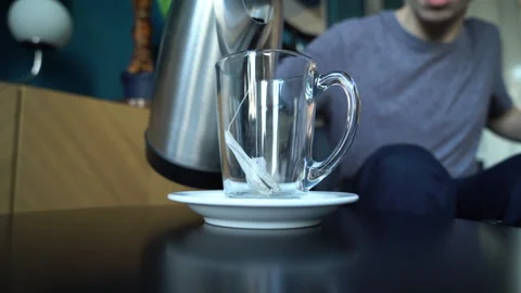 Young Man Preparing Tea with Tea Bag Stock Footage 274189413