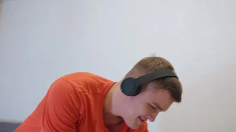 Young Man Pretending Mop Handle Is Guitar While Dancing Stock Footage 319919799