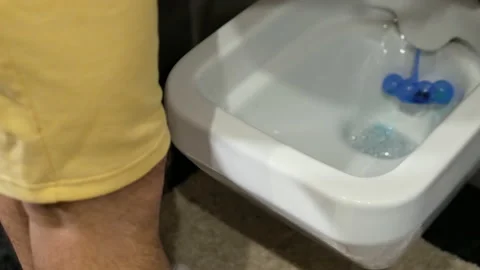 Young man with a problem of the genitourinary system. A man runs in the toilet Stock Footage 225157712