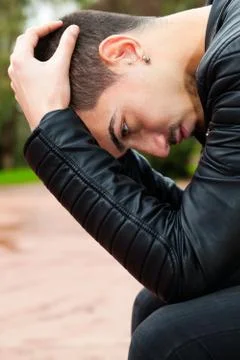 Young man with problems. Desperate men with hands on head. Close-up image of  Foto stock