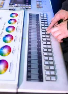 Young man in the process of offset printing and color correction Stock Photos