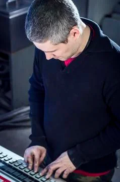 Young man in the process of offset printing and color correction Stock Photos