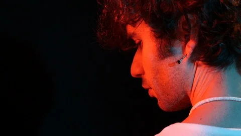 Young man profile with red light on black background	 Stock Footage 126856004