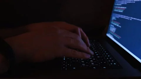 A young man programmer coding on a laptop Stock Footage 274095809