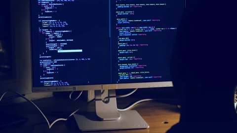 A young man programmer coding on a laptop 스톡 동영상 274096117