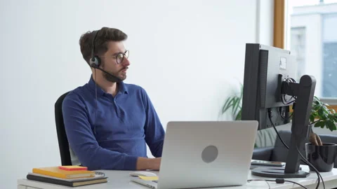 Young man programmer working on computer at small office Stock Footage 162468288
