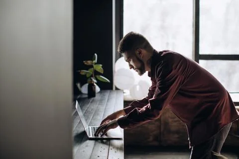 Young man programmer working at computer in office Stock Photos