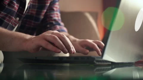 Young man programmer works at home at the computer. cozy room. keyboard Stock Footage 211812161