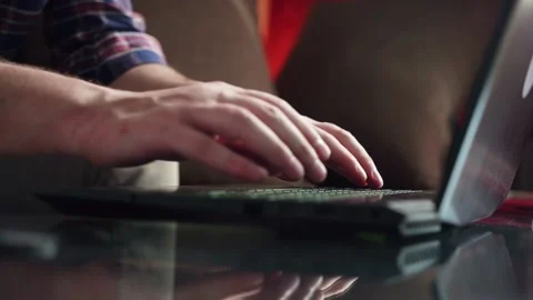 Young man programmer works at home at the computer. cozy room. keyboard Stock Footage 212608485