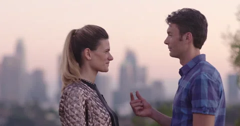 Young man proposing to girlfriend in Los Angeles at sunset 4K Stock Footage 67842129