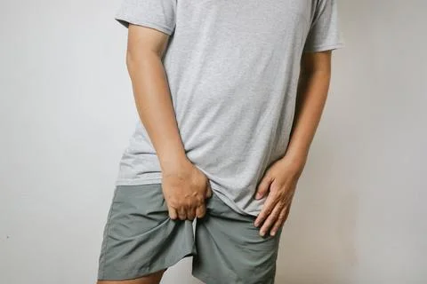 Young man with prostate problem in clinic, closeup. Cancer awareness concept Stock Photos