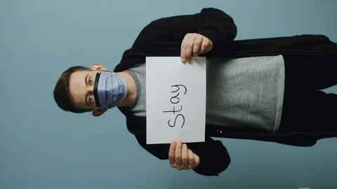 Young Man in Protective Mask Is Urging to Personal Responsibility Stock Footage 128512571