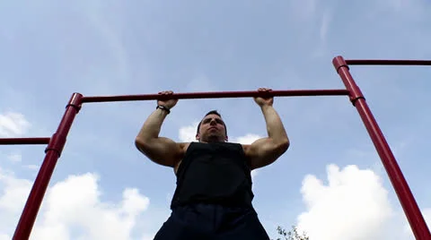 Young man pull ups bars workout exercise. hd Stock Footage 26355587